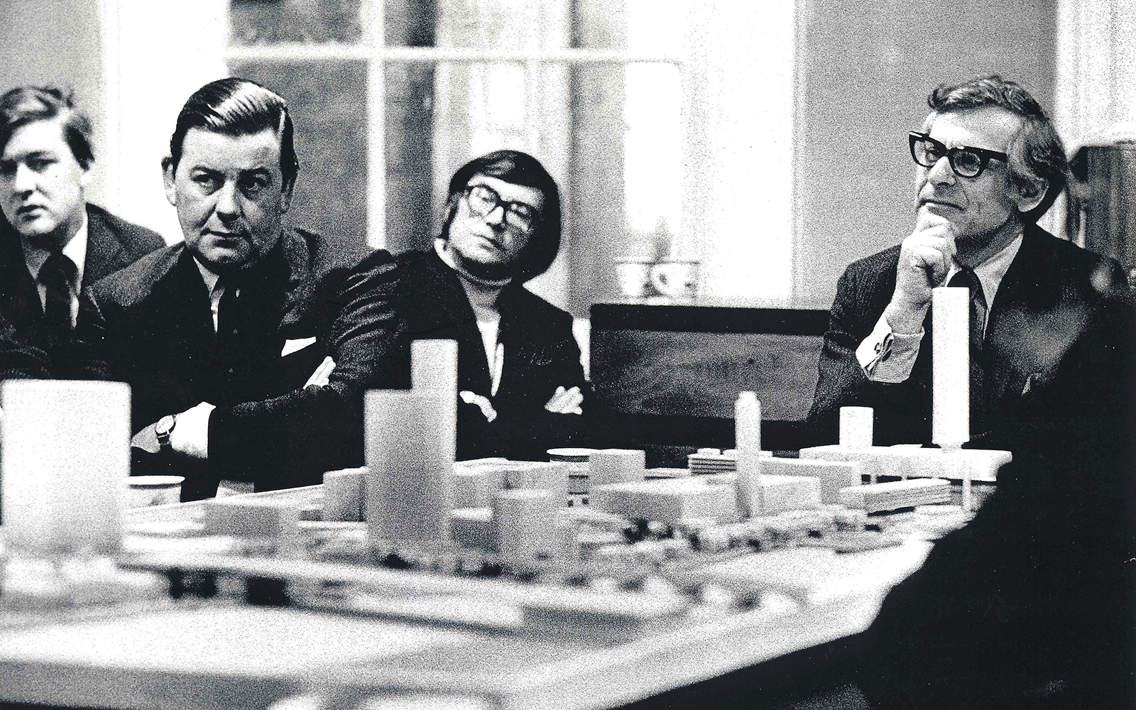 Sam Wanamaker Bankside plans Shakespeare's Globe A group of men sit around a table, with a model plan of buildings.