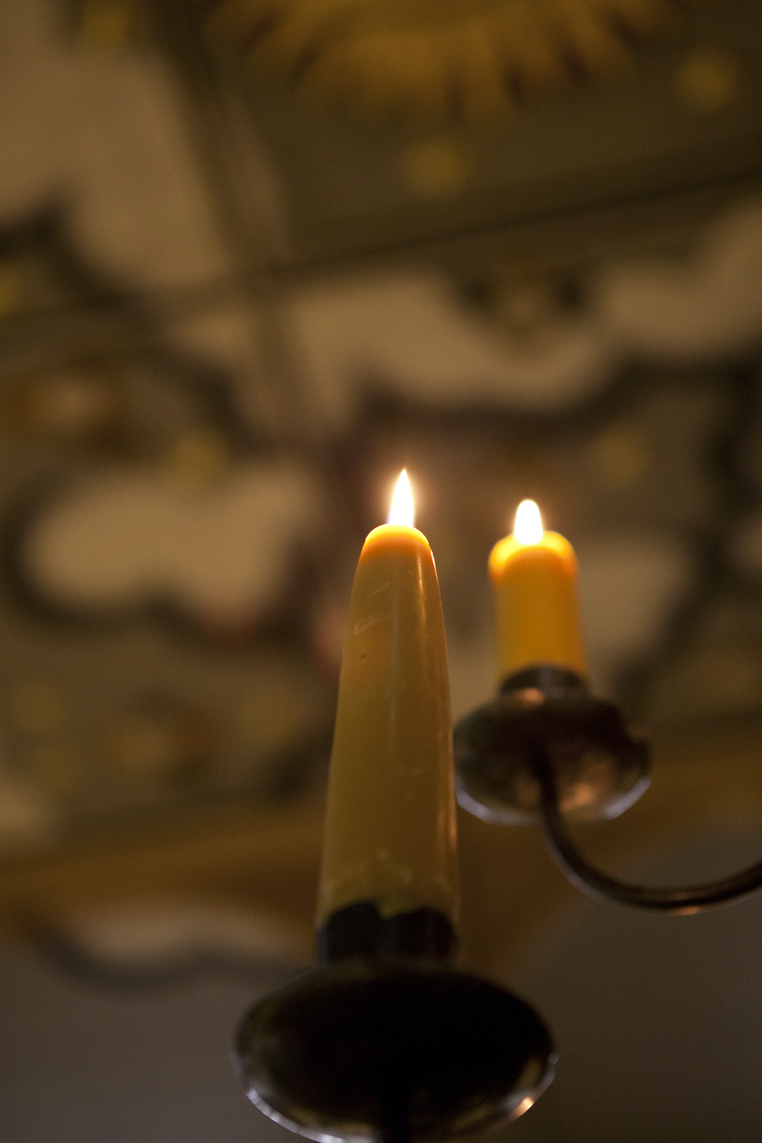 Sam Wanamaker Playhouse Pete Le May Two candles sit on a black candelabra