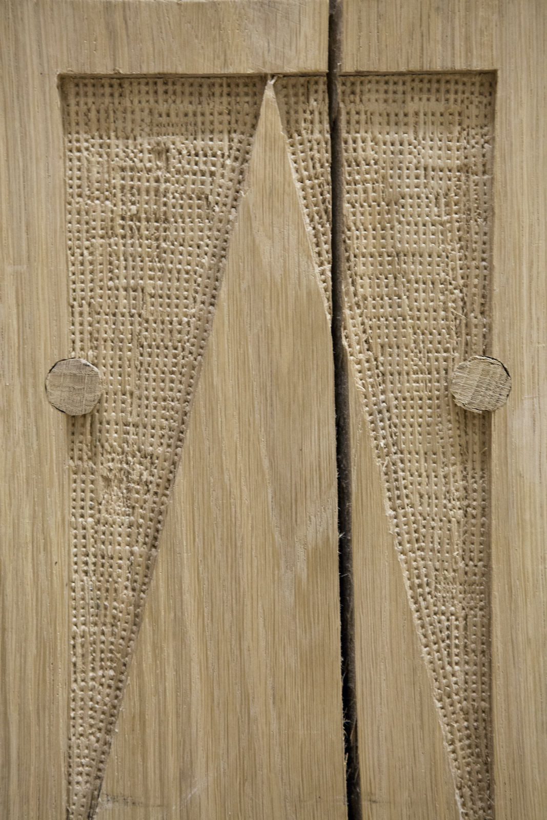 Sam Wanamaker PlayhoSam Wanamaker Playhouse Pete Le Mayuse A close up of a wooden material with textured patterns carved into it