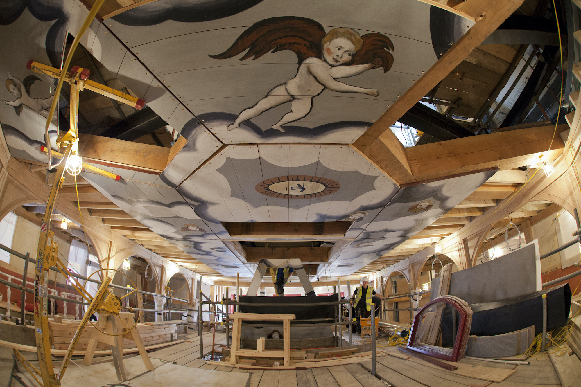 Sam Wanamaker Playhouse Pete Le May Construction People work on building scaffolding which reaches a decorated ceiling