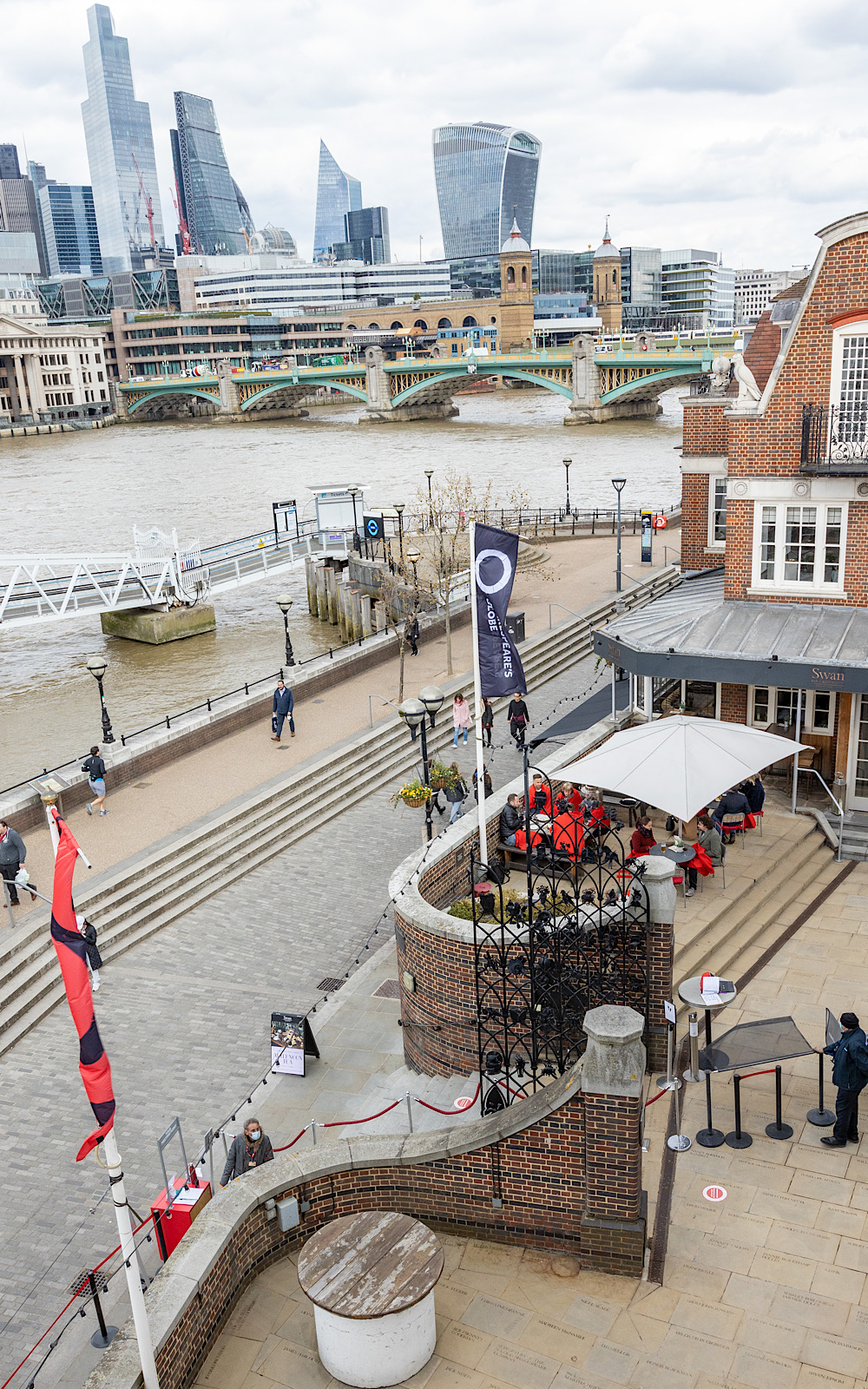 Guided Tours 2021 Pete Le May The view of a river from the top floor of a building, you can see a pier and tall buildings in the background