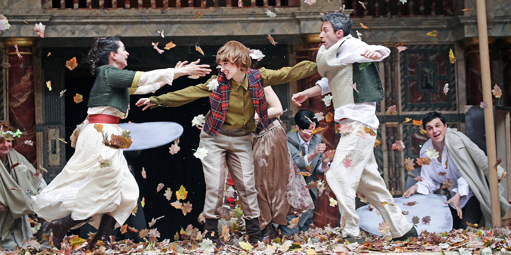 As You Like It Globe to Globe Festival Shakespeare's Globe 2012 Actors on the stage that look as if they were playing in leaves