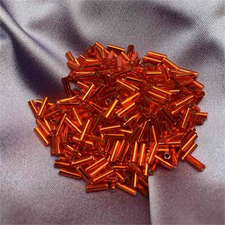 Toho Bugle Beads -  Transparent Silver Lined Lt Siam Ruby Image 1