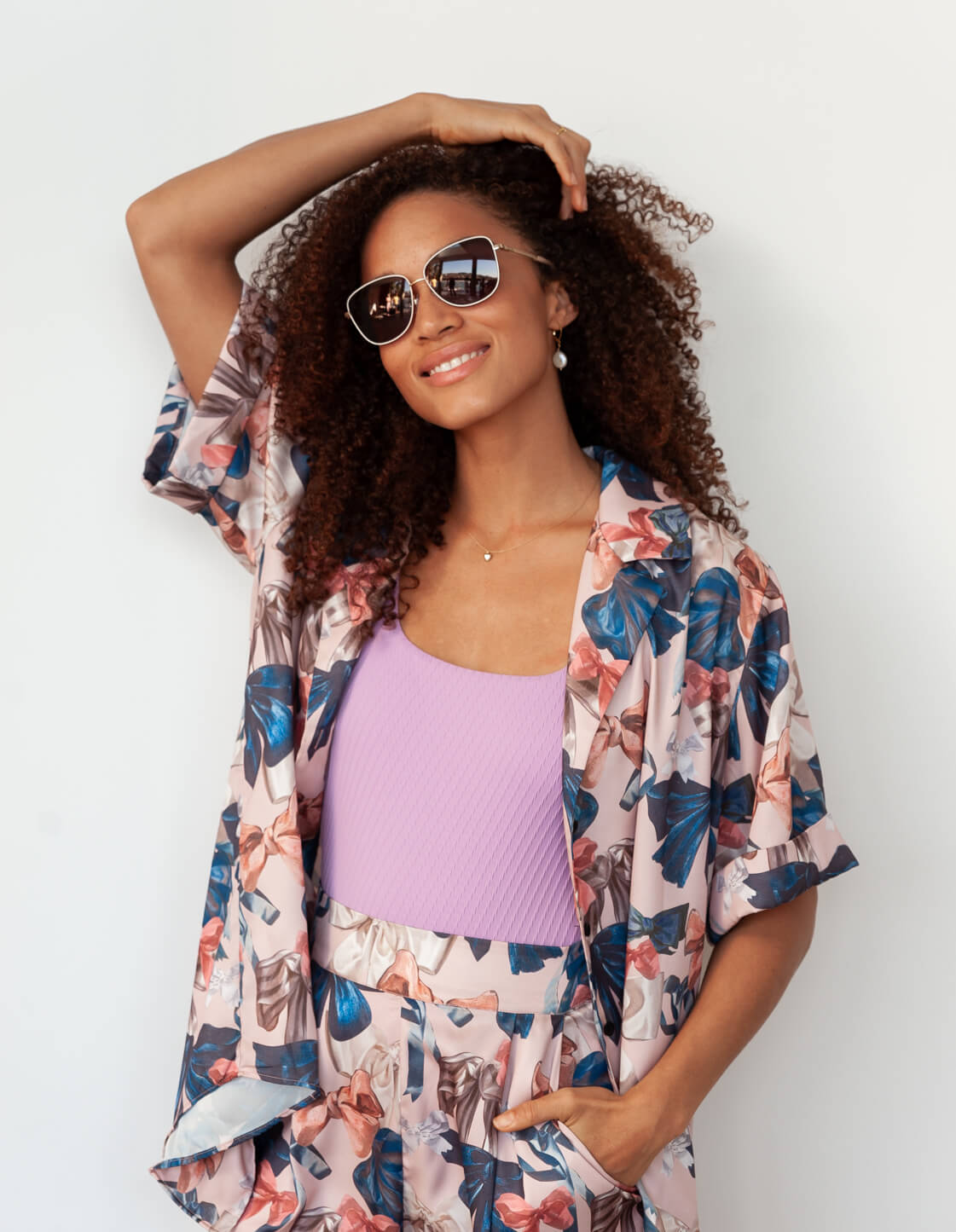 Woman in wearing brown sunglasses
