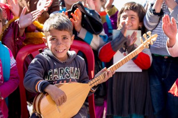 Music brings some joy into the lives of children who’ve fled ISIS terror.