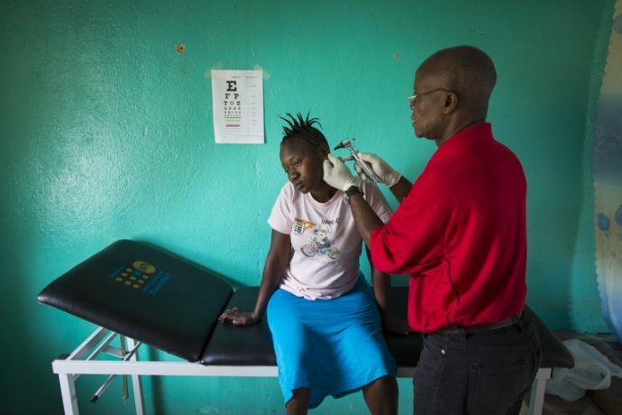 Esther Fayieh receives a check up at the survivors’ clinic in Lofa County, Liberia.