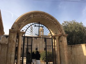 Father Benham and four members of his congregation enter their church. For some of the group, it is the first time they have done so since ISIS occupied it.