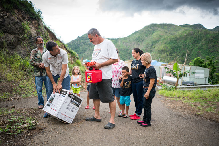 Emilio Rodriguez learns about the generator his family received from Samaritan's Purse. It will be used at the home of his disabled brother and sister.