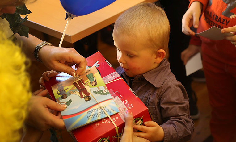 little boy receiving shoebox gift operation christmas child connect conference 2019