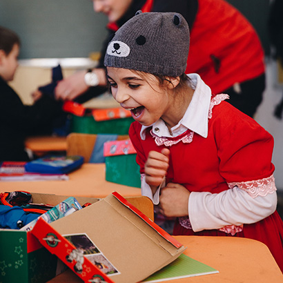 Child excited by shoebox