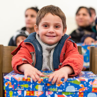 Boy with blue shoebox