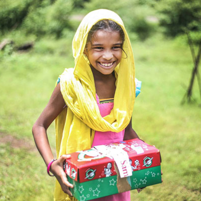 Girl holding shoebox gift