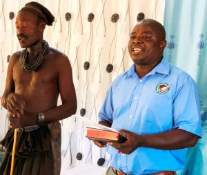 The village chief translating the service
