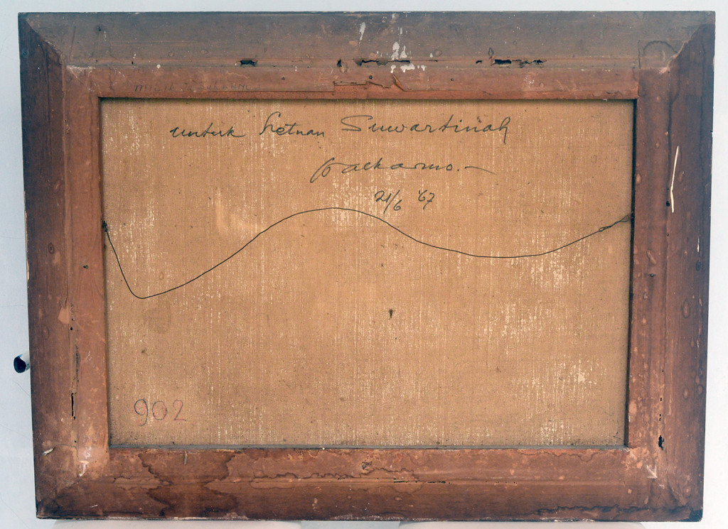 Two samples of Sukarno's collection of paintings with the marks behind the canvas.