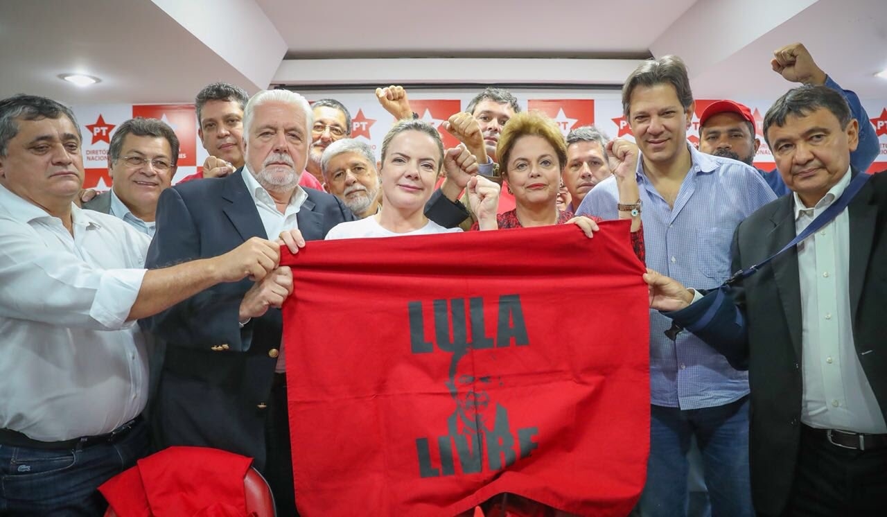 Brazilian PT militants holding a flag with the face of Lula asking for his freedom. SmartExpat