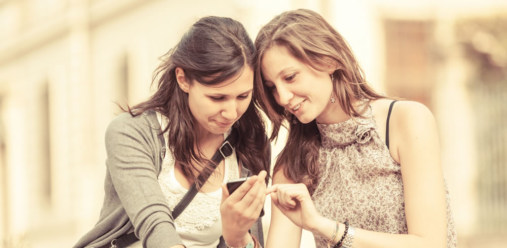 Girls learning on phone