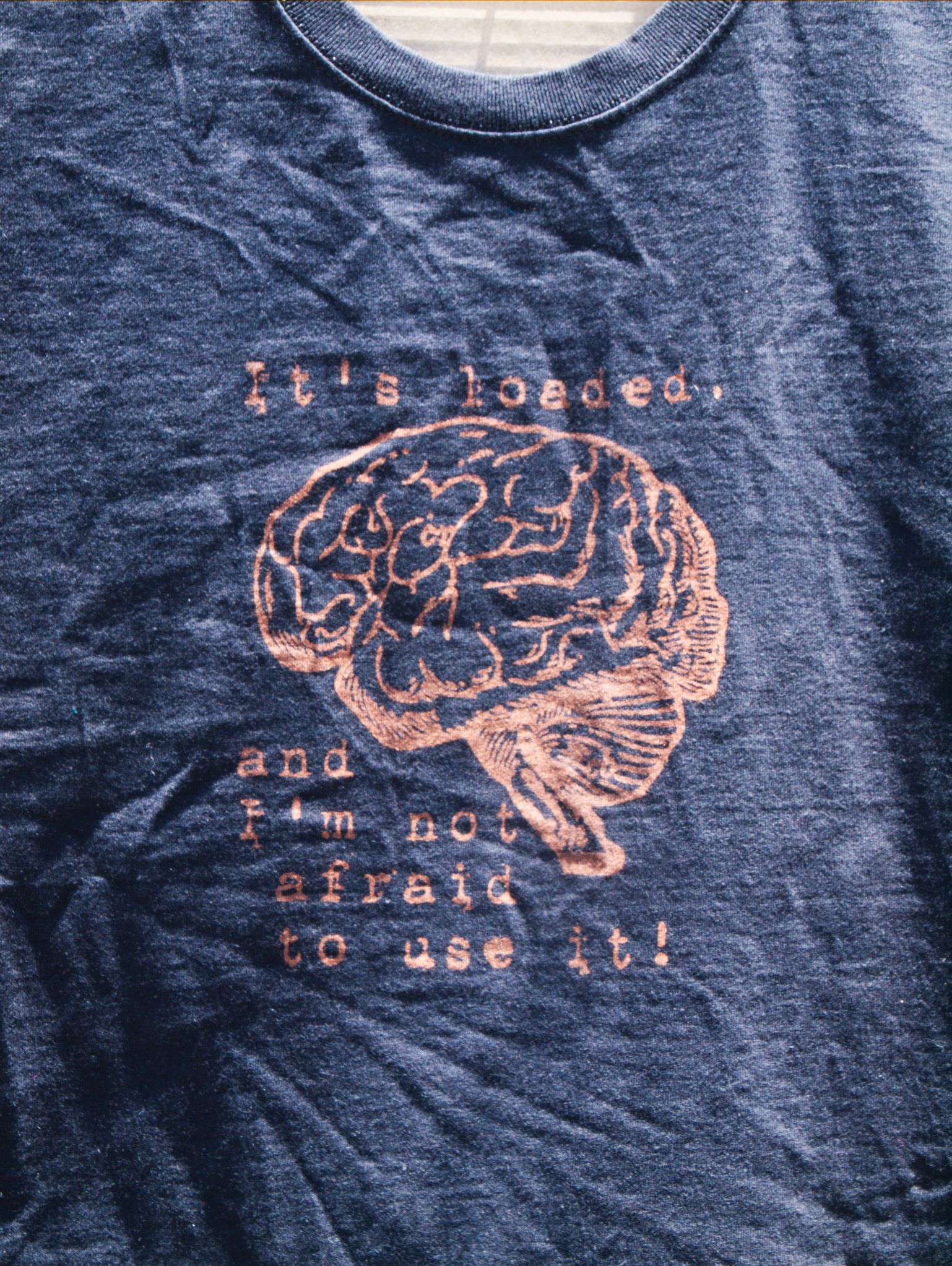 It's loaded and I'm not afraid to use it discharge tee shirt design with brain
