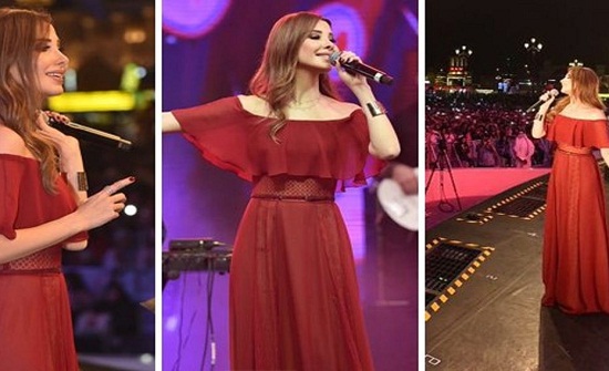 شاهد كيف عدلت نانسي عجرم من فستانها في حفل دبي!! شاهد كيف عدلت نانسي عجرم من فستانها في حفل دبي!!