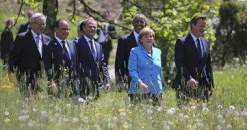 حشرة تؤخر ميركل عن الترحيب بكاميرون في قمة دول الـ7