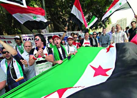 سوريون يتظاهرون في اربد تضامنا مع شعبهم  