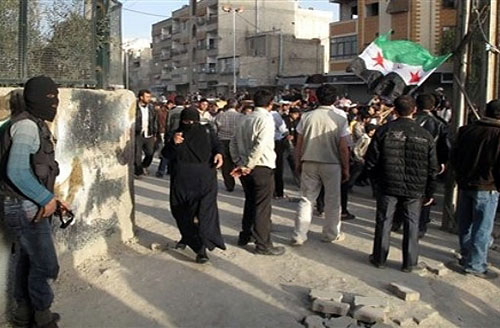 قوات النظام السوري تقصف حمص واشتباكات في ريف دمشق