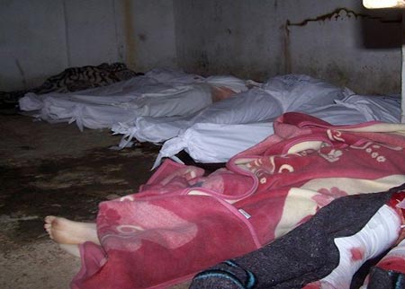 إعدام 12 عاملاً سورياًَ رمياً بالرصاص