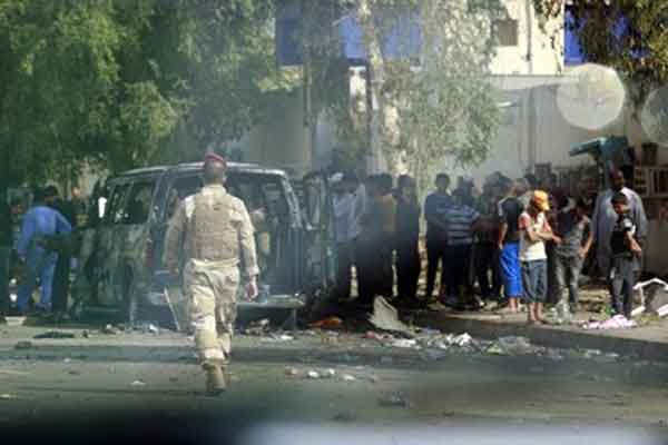 مقتل 13 وإصابة 100 في انفجار قنبلتين بالعراق