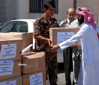 توزيع200 طرد غذائي على الاسر العفيفة بمعان