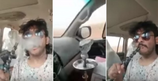 شاهد: شخص يدخن الشيشة أثناء قيادة سيارته على طريق سريع شاهد: شخص يدخن الشيشة أثناء قيادة سيارته على طريق سريع