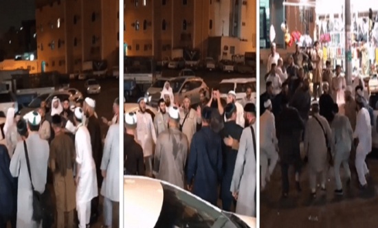 فيديو: شاهد حجاج يمارسون طقوس غريبة بأحد شوارع مكة.. ومواطن يحاول منعهم!