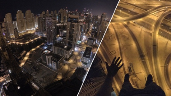 شاهد: متهور يتدلى من قمة برج بدبي بدون معدات السلامة