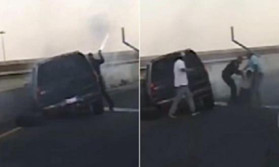 شاهد.. شرطي شجاع ينقذ رجلاً من سيارته المحترقة