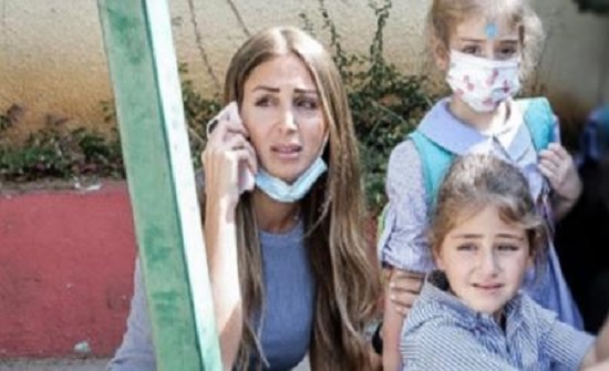 اللبنانية صاحبة الصورة الشهيرة.. تكشف كيف نجت من قذيفة
