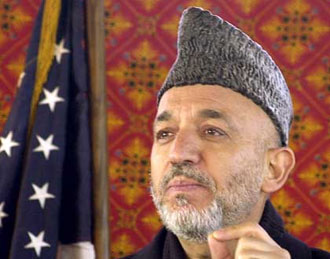 كرزاي يعلن بدء انتقال مسؤولية الامن للقوات الافغانية في آذار   