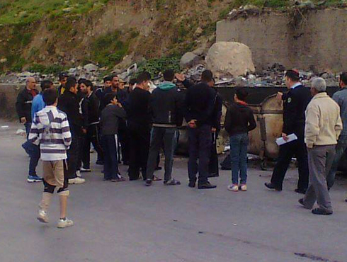 بالصور : العثور على جثة رضيع متفحمة في حاوية قمامة بإربد