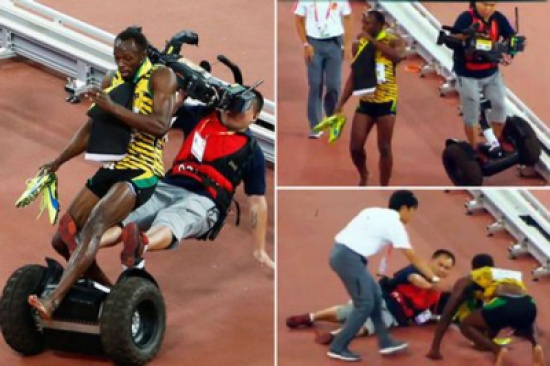 شاهد..  ارتطام مصوّر بالعداء بولت أثناء احتفاله بفوزه