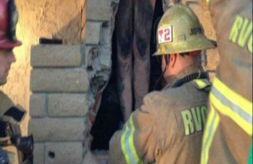 إمرأة عارية علقت في مدفأة منزل زوجها
