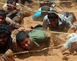 الثوار يتهمون القذافي بتجنيد مجرمين