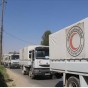 قوافل مساعدات تدخل مناطق محاصرة في وقت سابق  - ارشيف