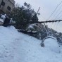 سقوط عامود كهربائي بسبب الثلوج - ارشيفية
