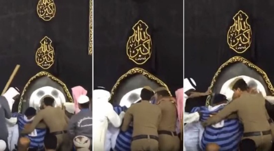 بالفيديو: رجلا أمن في المسجد الحرام يحملان مقعداً كي يتمكن من تقبيل الحجر الأسود بالفيديو: رجلا أمن في المسجد الحرام يحملان مقعداً كي يتمكن من تقبيل الحجر الأسود
