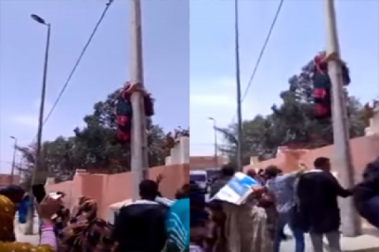 شاهد: لحظة تسلق سيدة مغربية “حامل” عامودًا كهربائيًا لتنتحر !