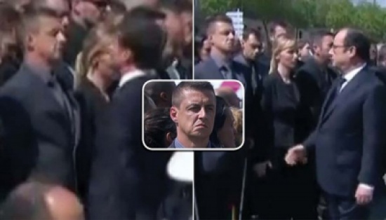 شاهد.. شرطي فرنسي يرفض مصافحة الرئيس هولاند ورئيس الوزراء