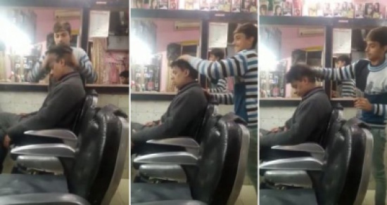 مساج للرأس من نوع فاخر.. بالفيديو: حلاق هندي مجنون يتعامل مع زبائنه بشده