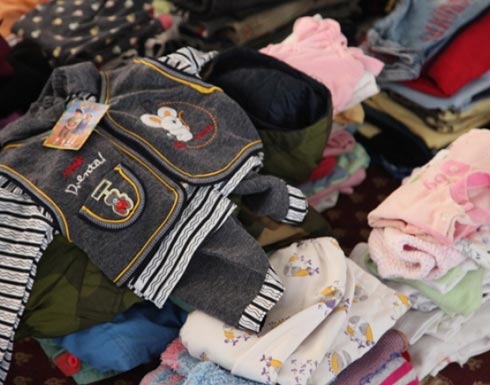 توزيع كسوة الشتاء على 60 اسرة محتاجة بلواء القصر