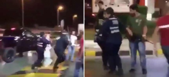 شاهد: مشاجرة كويتيين عند محطة وقود.. ورجل أمن يشهر سلاحه