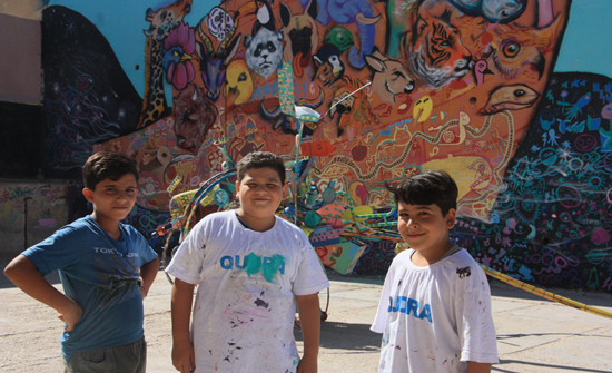 الزرقاء...فنانون وطلبة يحولون أسوار مدرسة الأمير محمد إلى لوحة فنية