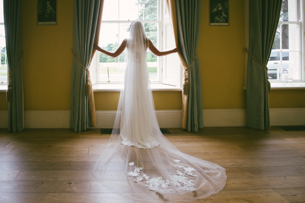 Ali and Ronan at Carton House. Bride at window.