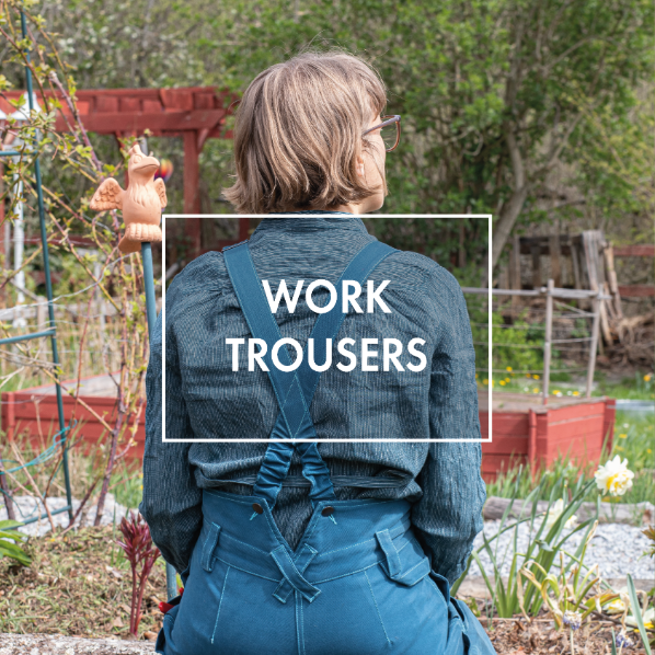 A woman wearing petrol dungarees and a flaux shirt sitting in a garden, picture taken from behind.