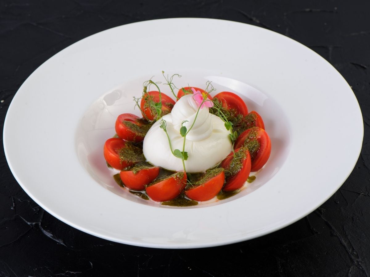 Burrata with cherry tomatoes and pesto sauce Order Delivery Burrata